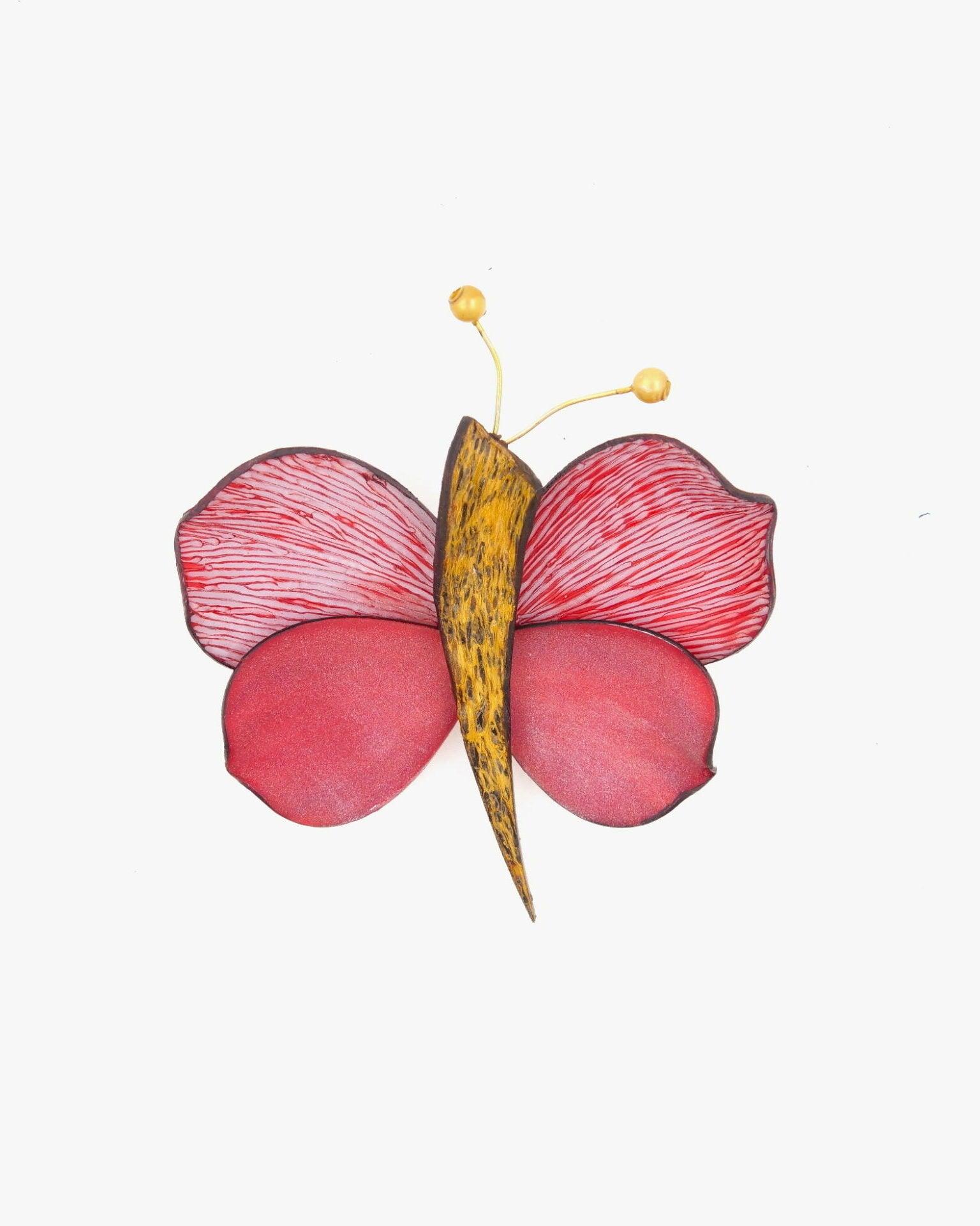 Broche papillon rose avec antennes dorées