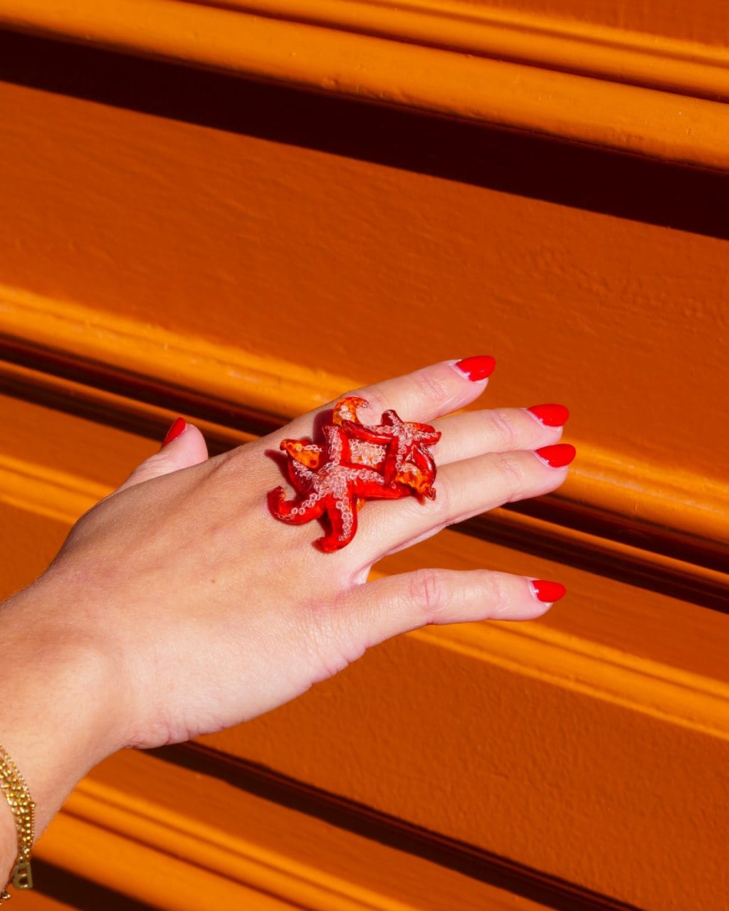 all-groups bague en forme d'etoile de mer rouge Ariel