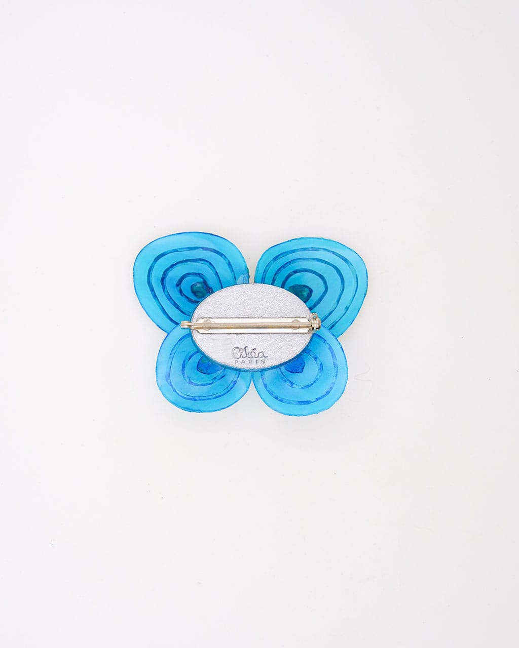 La pièce unique 15 vue de dos pour une meilleure vue d'ensemble de la broche papillon bleue.