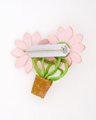 all-groups broche jardin représentant des plants rose vue de dos