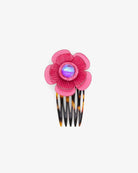 la couleur rose représente la passion sur cet accessoire cheveux pour femme