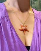 all-groups pendentif étoile sur robe violet lavande