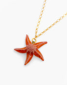 all-groups le pendentif Ariel en forme d'etoile de mer orange est pour femme